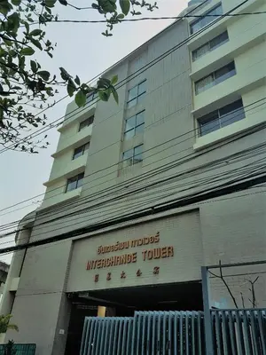 a building with a sign on the front of it at Interchange Tower Serviced Apartment - SHA Extra Plus in Bangkok