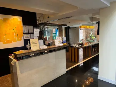 a restaurant with a counter with a counter sidx sidx sidx at Silom Convent Garden in Bangkok