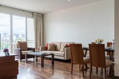 a living room with a couch and a table at Bangkok Patio BTS Sanam Pao in Bangkok