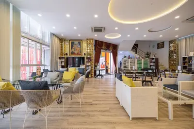 a store with chairs and tables in a room at Bangkok Rama Hotel in Bangkok