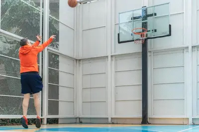 a man playing basketball on a basketball hoop at Jasmine 59 Hotel in Bangkok