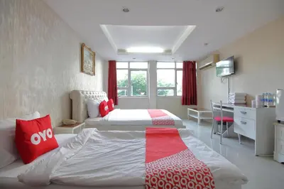 a hotel room with a bed and a kitchen at Diamond Residence Silom in Bangkok