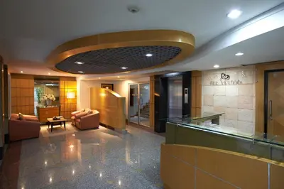 a lobby of a hotel with a waiting room at Ravipha Residences in Bangkok