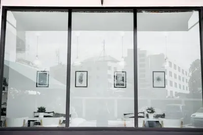 a glass window with a view of a city at Studio 41 Salaya-Sai4 in Nakhon Pathom