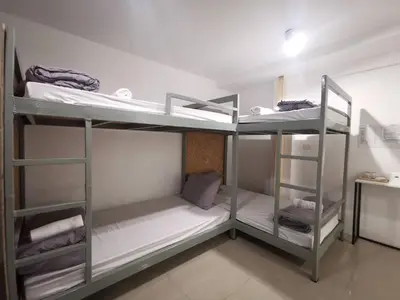 a room with three bunk beds in a room at Studio 41 Salaya-Sai4 in Nakhon Pathom
