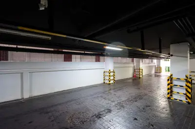 a blurry photo of an empty parking garage at Marvin Suites Hotel in Bangkok