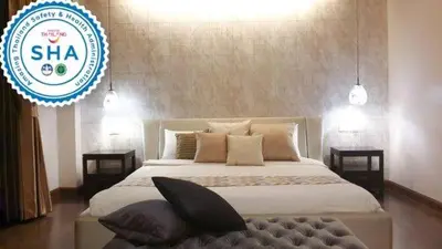 a bedroom with a large bed with a sign at W 21 Hotel Bangkok in Bangkok
