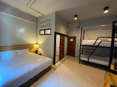 a bedroom with two bunk beds in a room at W22 by Burasari in Bangkok