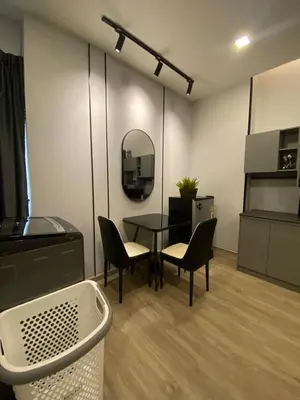 a room with a table and chairs and a mirror at Bangyai Inn-private room in Nonthaburi