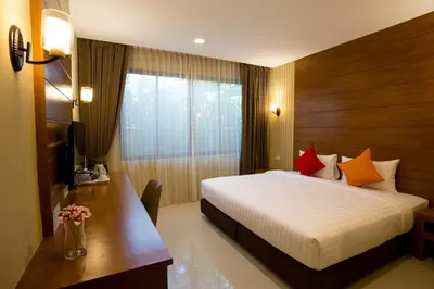 a hotel room with a bed and a desk and a television at S Bangkok Hotel, Navamin in Ban Khi Sua