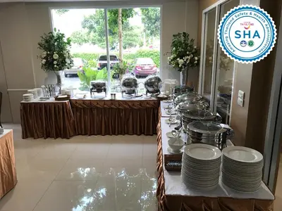 a buffet line with dishes and plates on a table at S Bangkok Hotel, Navamin in Ban Khi Sua