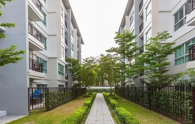 a walkway between two apartment buildings at The Cube Residence Government Complex Laksi in Lak Si