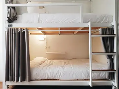 a bunk bed in a room with a bunk bed in a room at LITA Bangkok in Bangkok