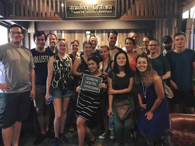 a group of people posing for a picture at Suneta Hostel Khaosan in Bangkok