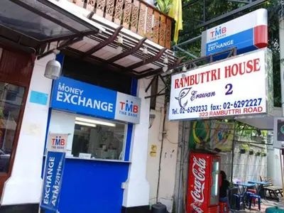 a building with signs on the side of it at Rambuttri House in Bangkok