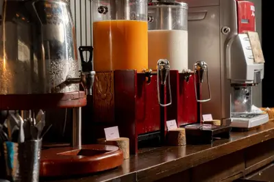 a kitchen counter with a counter top with a mixer at La Petite Salil Sukhumvit 11 in Bangkok