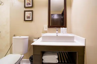 a bathroom with a sink and a toilet at Baan Sukhumvit Soi 20 in Bangkok