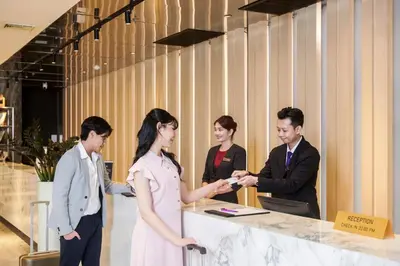 a group of people standing around a counter at TK Palace Hotel & Convention Bangkok in Bangkok