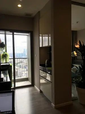 a room with a kitchen with a view of a balcony at Bangkok view,Luxurious 1 Bedroom Sathon in Bangkok