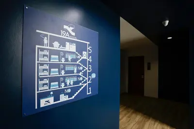 a blue wall with a picture of a room at 19A Bangkok in Bangkok