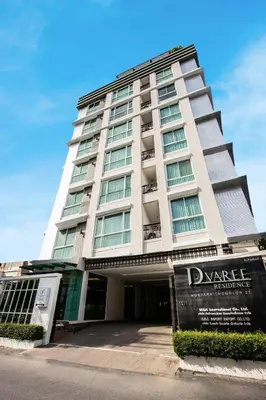 a tall building with a sign in front of it at D Varee Montara Thonglor 25 in Bangkok