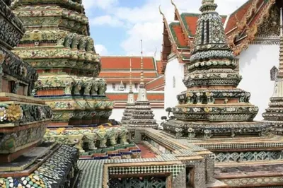 a group of pagodas in front of a building at 51 Suanplu Residence in Bangkok