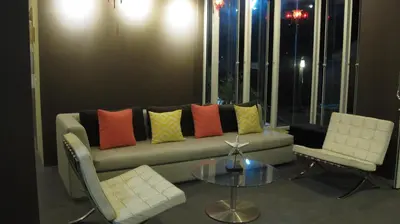 a living room with a couch and two chairs and a table at U431 Chaengwattana in Nonthaburi