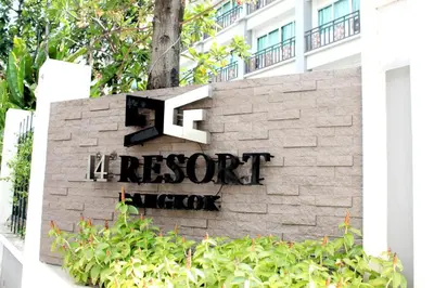 a sign for the resort lobby in front of a building at 14 Resort in Bangkok