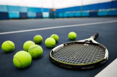 a bunch of tennis balls on a tennis court at Riverine Place Hotel and Residence in Nonthaburi