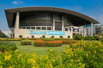 a building with a sign in front of a stadium at Botanic Service Room at Impact Muangthongthani - SHA Certified in Nonthaburi