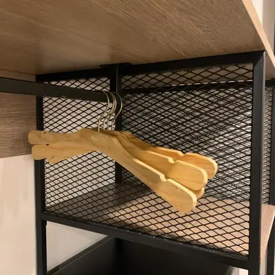 a wooden glove on a shelf in a bunk bed at Toptel Thaphra - ท็อปเทล ท่าพระ in Bangkok