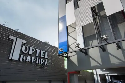 a sign on the side of a building at Toptel Thaphra - ท็อปเทล ท่าพระ in Bangkok