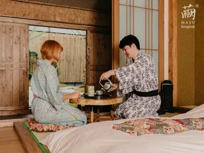 a man and woman in kimonos in a room at MAYU Bangkok Japanese Style Hotel in Bangkok