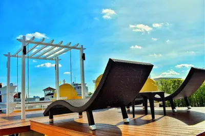 two chairs sitting on top of a deck at Siri Oriental Bangkok Hotel in Bangkok