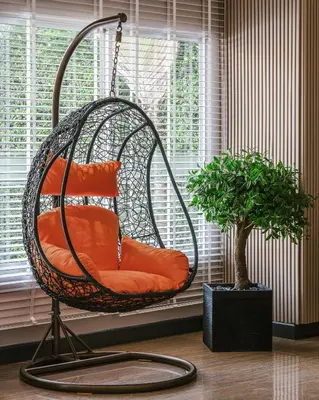 a swing chair sitting in front of a window at Season Place in Bangkok