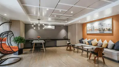 a living room with a couch and a table at Season Place in Bangkok