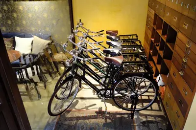 a group of bikes parked in a room at Old Capital Bike Inn - SHA Certified in Bangkok