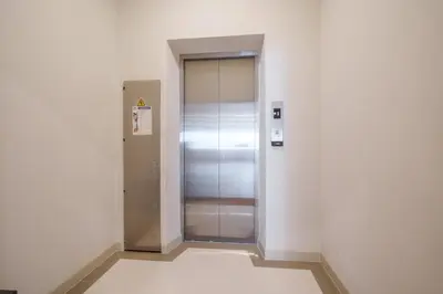 a elevator in a building with its door open at Triple Four in Bangkok