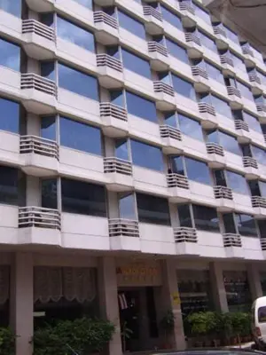 a large building with balconies on the side of it at Bangkok City Inn in Bangkok