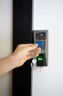 a hand is putting a key in an atm at Platinum Deluxe Shopping Apartments in Bangkok
