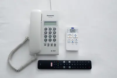 an office phone with a keyboard and a calculator at V One Pride-Sukhumvit 22, Bangkok in Bangkok