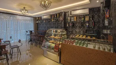 a bakery with a display case in a restaurant at V One Pride-Sukhumvit 22, Bangkok in Bangkok