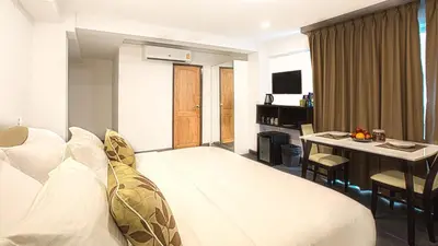 a hotel room with a bed and a desk at V One Pride-Sukhumvit 22, Bangkok in Bangkok