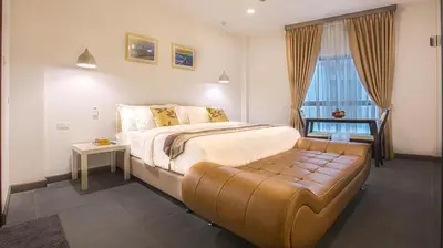 a bedroom with a large bed and a window at V One Pride-Sukhumvit 22, Bangkok in Bangkok