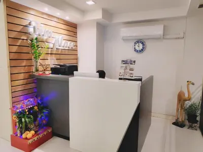 an office with a reception desk and a counter at Tim Place - BTS Phra Khanong in Bangkok