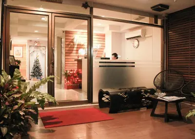 a living room with a christmas tree in the window at Tim Place - BTS Phra Khanong in Bangkok