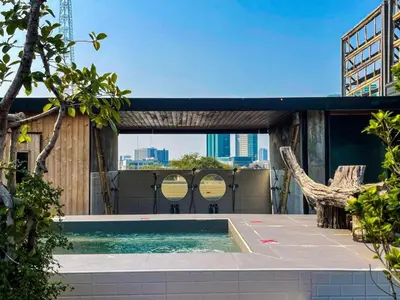 a swimming pool on the roof of a building at Blu Cabin Ari Stylish Gay Poshtel in Bangkok
