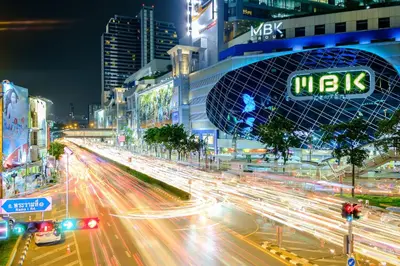 a busy city street at night with streaks of lights at Centre Point Hotel Chidlom Bangkok in Bangkok