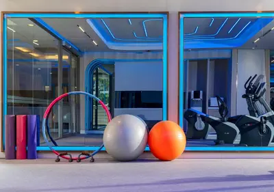 a gym with balls and exercise equipment in front of a building at Centre Point Sukhumvit 10 in Bangkok
