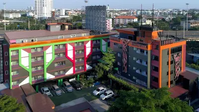 an overhead view of a building with colorful paint on it at The Breton Hotel Media in Bangkok